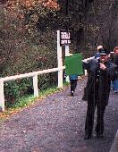 Guard signals puffing billy in Victoria's Dandenongs; puffy06b.jpg - 8679 Bytes