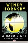 book cover, A Hard Light, by Wendy Hornsby; 90x139