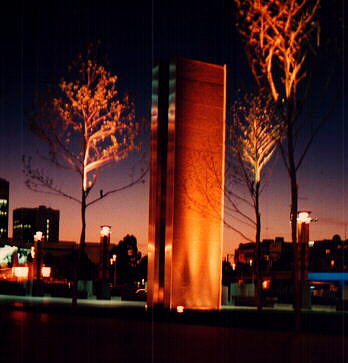 Gas flame-bearing plinth, Southbank, at night
